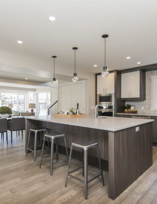 A beautiful shot of a modern house kitchen and dining room